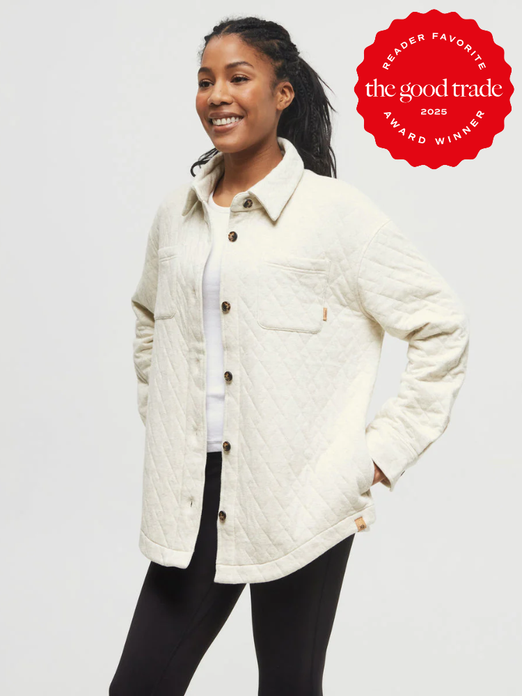 Person wearing a cream quilted jacket and white shirt stands smiling. "The Good Trade 2025 Reader Favorite Award Winner" badge shown in the top right corner.