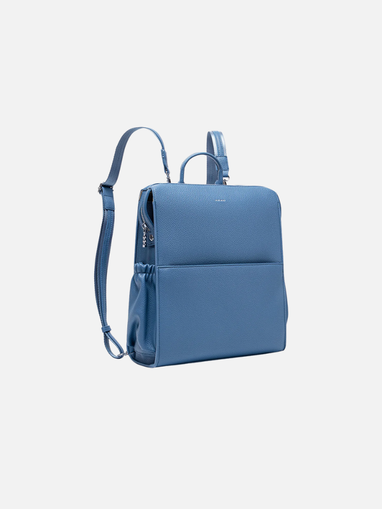 Blue leather backpack with adjustable straps, a front pocket, and a top handle, displayed against a plain white background.