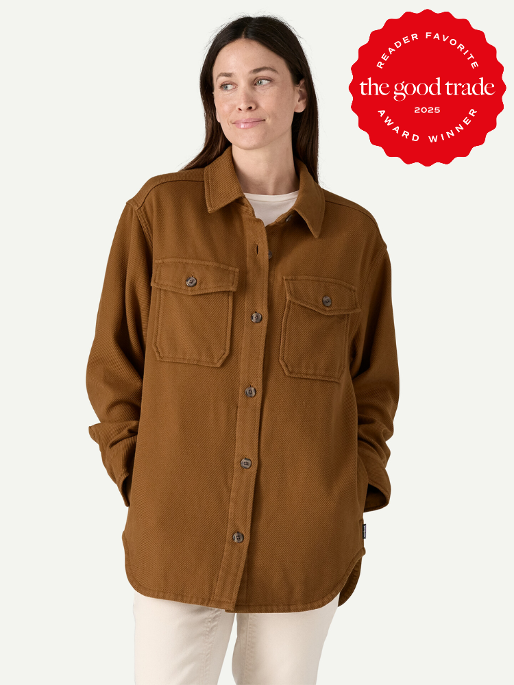 Person wearing a brown button-up shirt with pockets, standing with hands in pockets. A red badge reads "Reader Favorite, the good trade, Award Winner 2025.