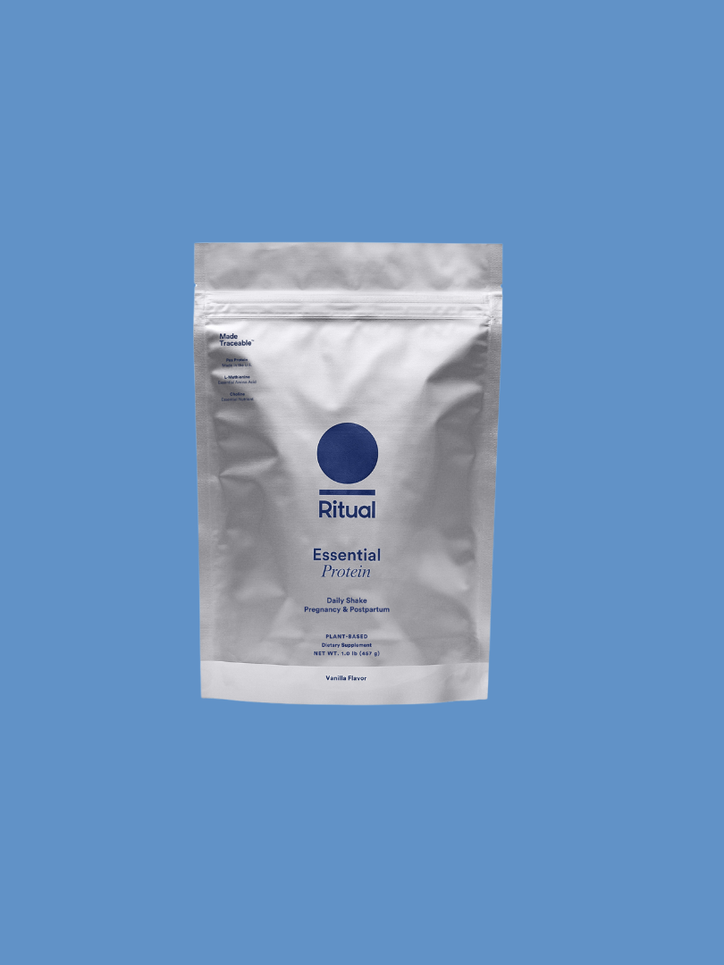 White packet of Ritual Essential Protein with a blue circle and text on a blue background.