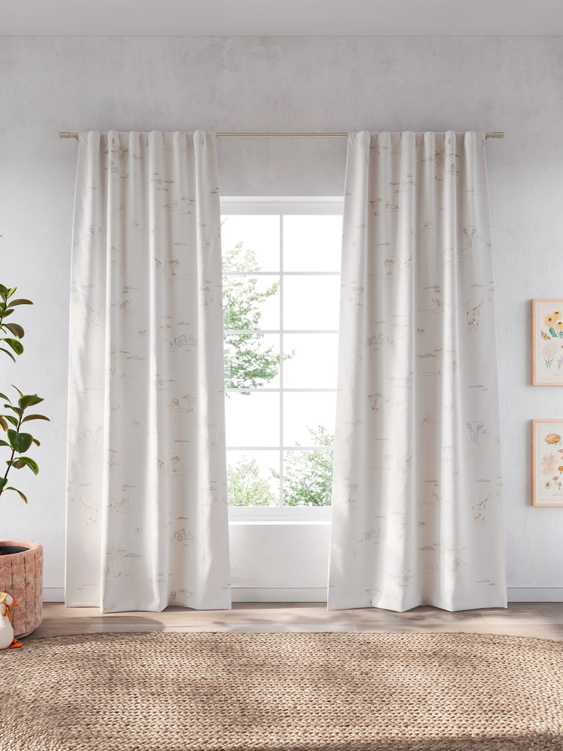 White curtains hang on a rod in front of a large window with a view of greenery. A potted plant and framed artwork decorate the room.