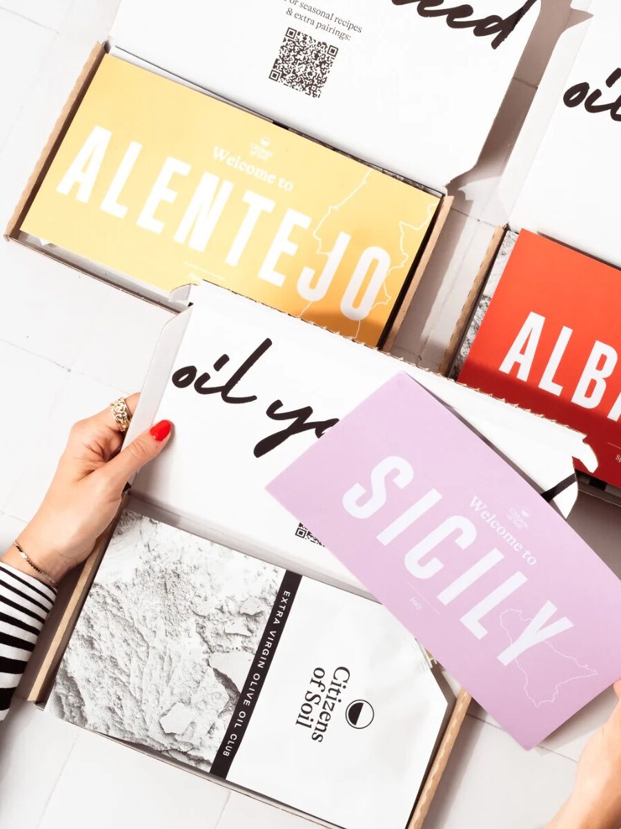 Person holding packages labeled Alentejo, Albacete, and Sicily.