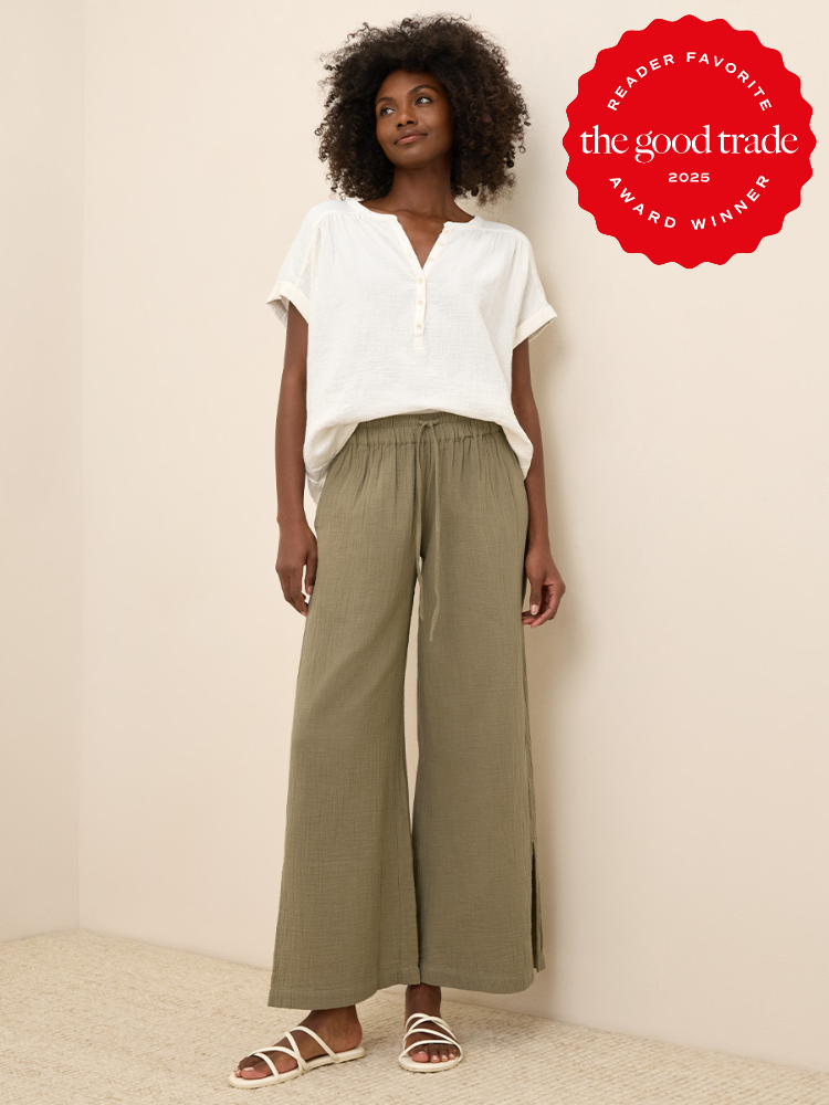 Person wearing a white short-sleeve blouse, olive green wide-leg pants, and white sandals. Red badge in the corner reads "Reader Favorite The Good Trade 2023 Award Winner.