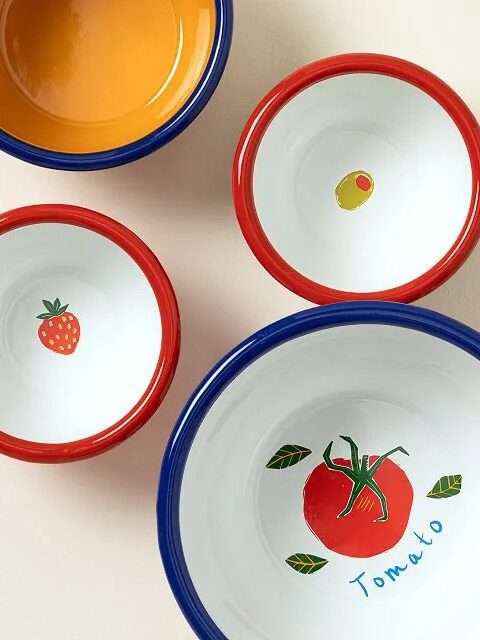Four ceramic bowls with colorful rims; inside are painted images of a tomato, olive, strawberry, and plain orange.