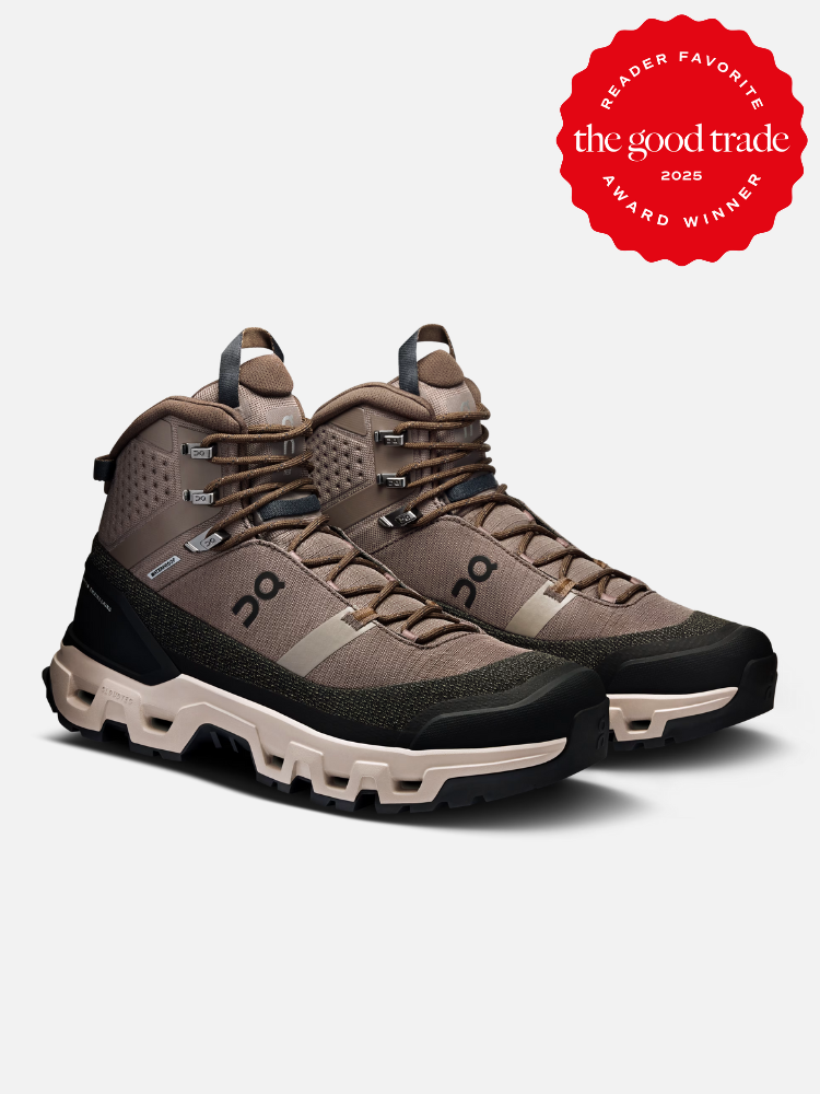 A pair of brown and black hiking boots with high tops and rugged soles, displayed on a white background. A red "Reader Favorite" award badge is shown in the upper right corner.