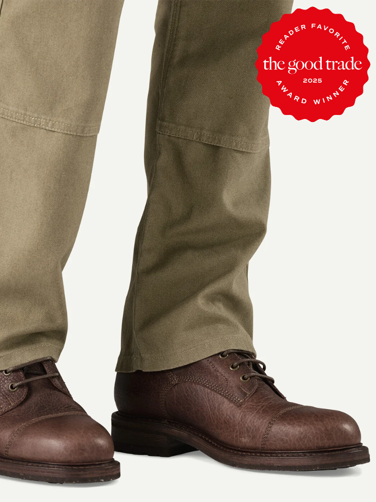 A person wearing olive green pants and brown leather boots, with a red "Reader Favorite The Good Trade Award Winner 2025" badge in the top right corner.