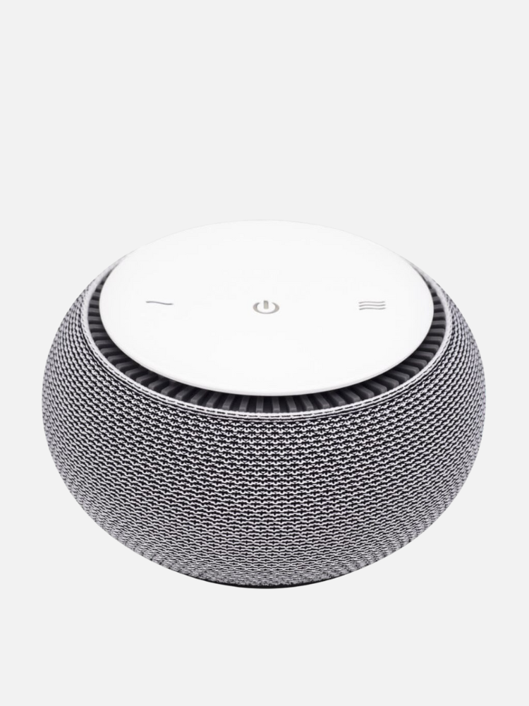 A spherical smart speaker with a mesh exterior and white touch controls, including power and volume, on top.