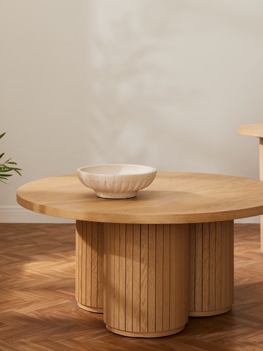 A circular wooden coffee table from Joybird. 