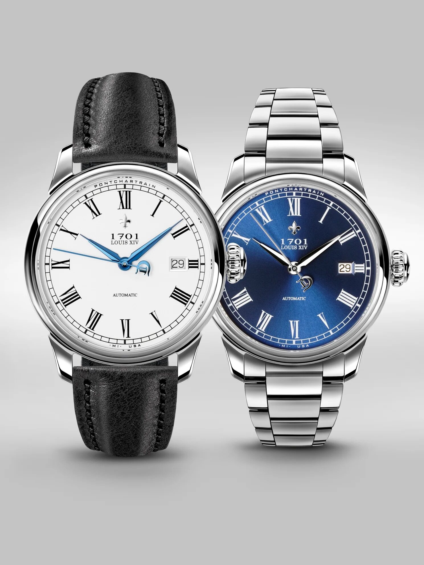 Two wristwatches are displayed side by side: one with a black leather strap and white dial, the other with a silver metal bracelet and blue dial. Both show the date and have Roman numerals.