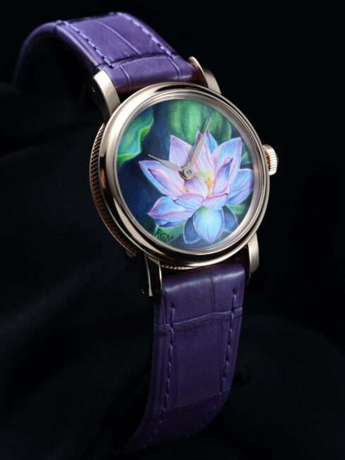 A wristwatch with a purple leather strap and a dial featuring a detailed painting of a lotus flower against a green background.