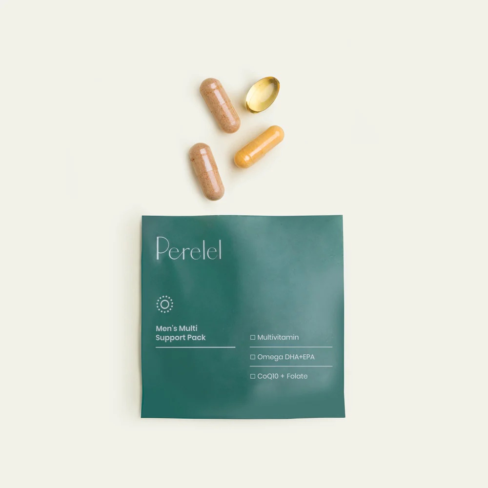 A green packet labeled "Perelel Men's Multi Support Pack" is shown with four capsules, one yellow and three brown, arranged above it on a light background.