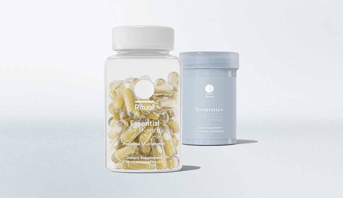 A clear bottle of Ritual Essential for Women multivitamins and a blue container of Ritual Synbiotic+ dietary supplements are displayed against a light background.