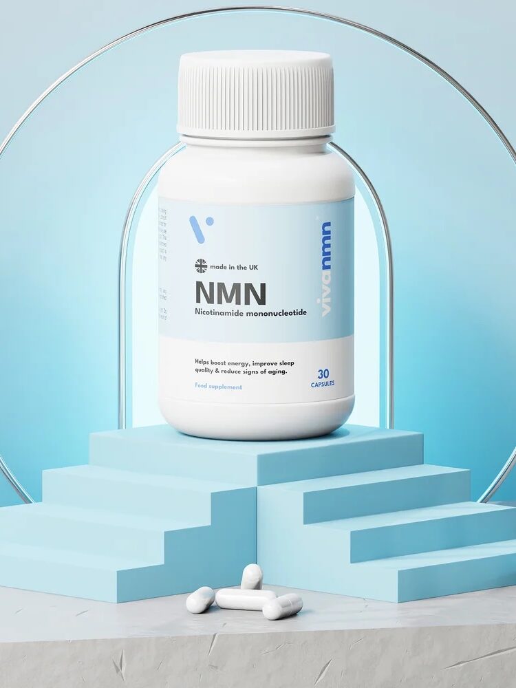 Three white supplement bottles labeled "NMN" are displayed on a blue and white platform, with two capsules in front. The bottles show front, side, and back views.