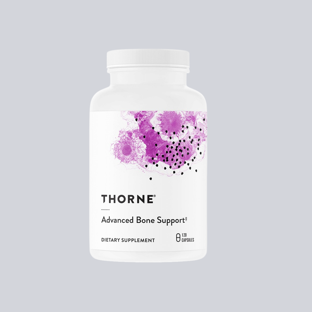 A white bottle of Thorne Advanced Bone Support dietary supplement, featuring a purple abstract design on the label.