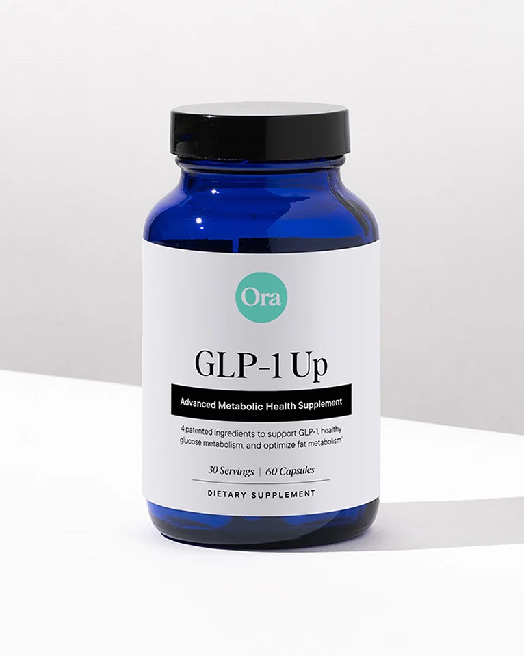 A blue bottle labeled "Ora GLP-1 Up Advanced Metabolic Health Supplement" containing 60 capsules, placed on a white surface with a light background.