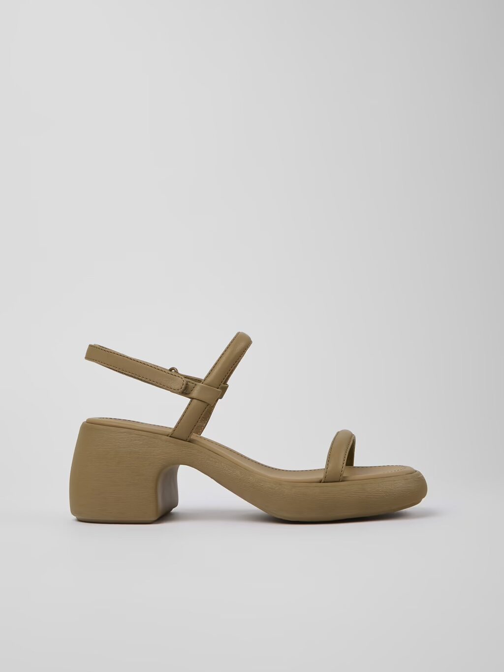 A tan sandal with a high heel.
