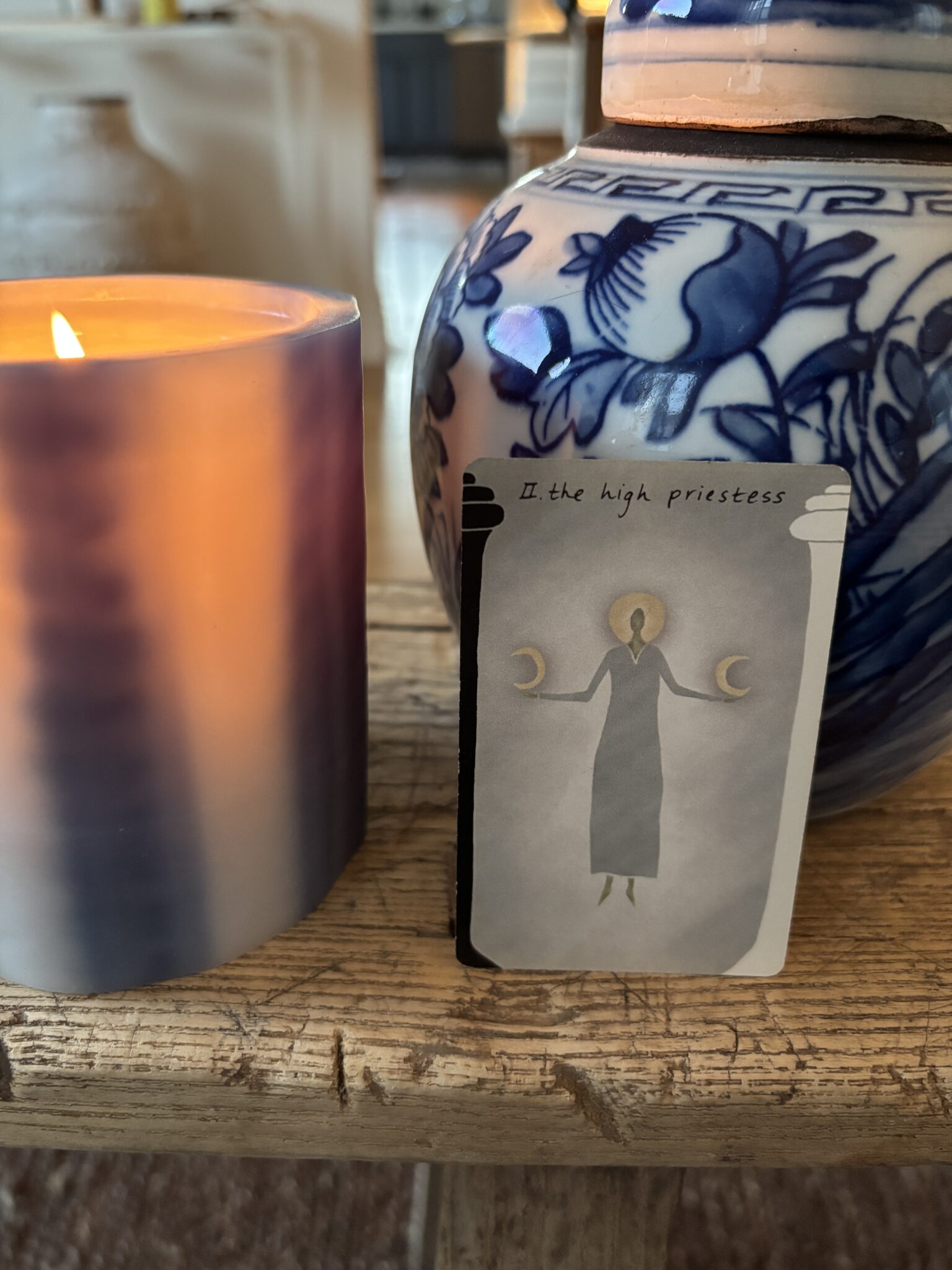 A card next to a candle.