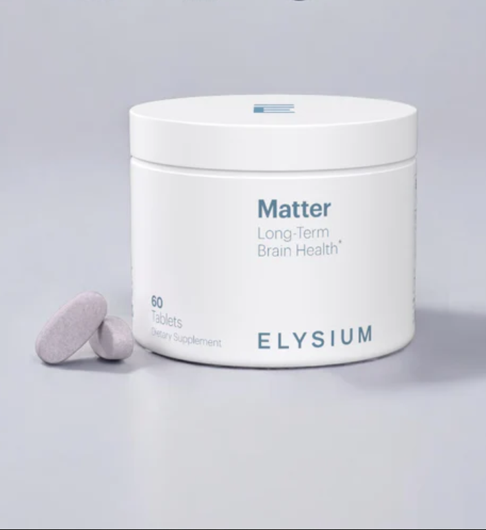 A white container labeled "Matter Long-Term Brain Health" by Elysium sits beside two oval tablets; the container holds 60 dietary supplement tablets.