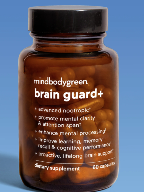 A brown bottle labeled "mindbodygreen brain guard+" dietary supplement with 60 capsules, set against a blue background with a "bestseller" tag in the top right corner.
