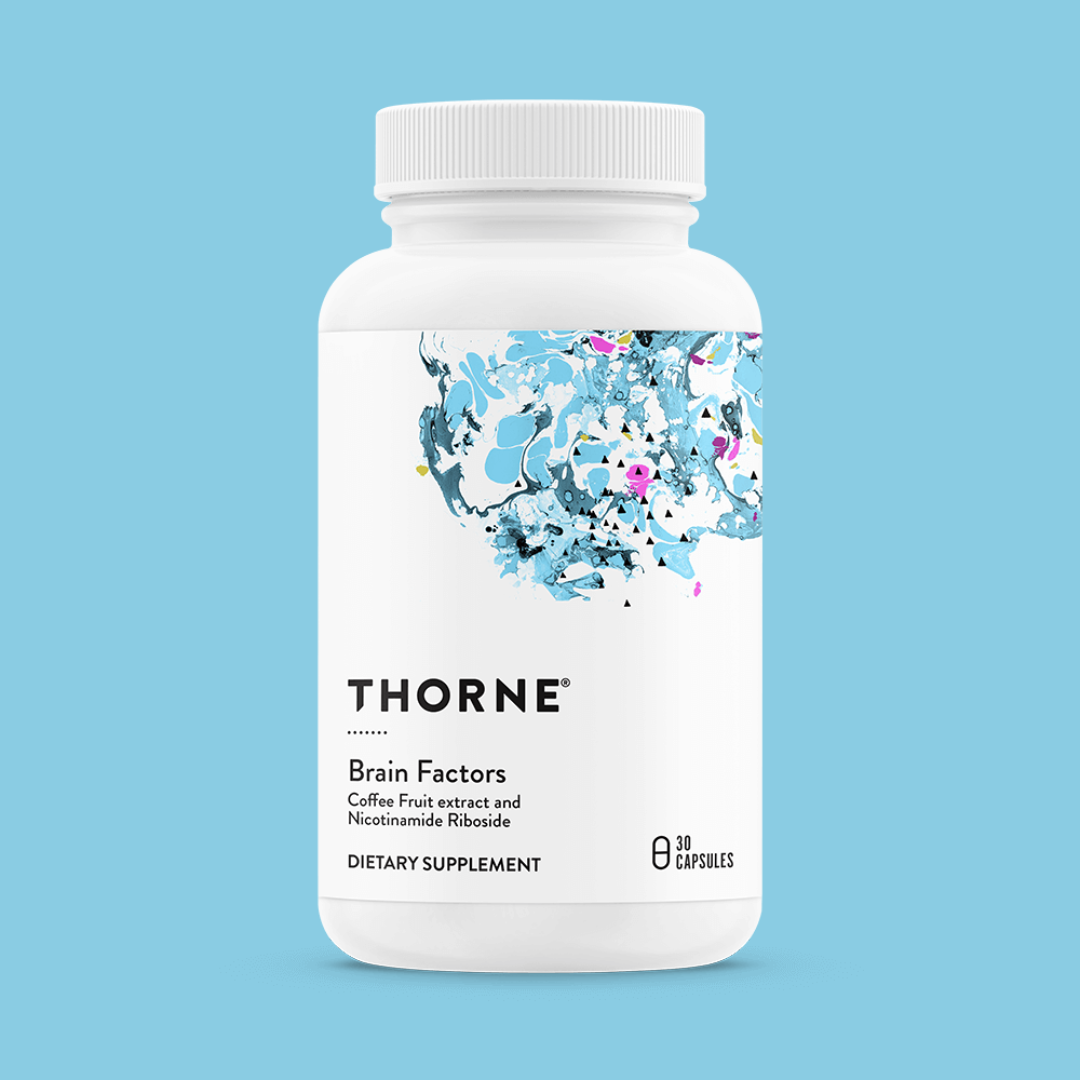 A white bottle of Thorne Brain Factors dietary supplement with a blue abstract design on the label, containing 30 capsules, on a light blue background.