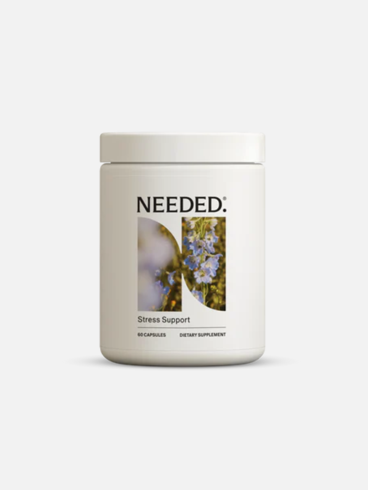 A white bottle labeled "NEEDED: Stress Support" with an image of flowers, containing 60 capsules of dietary supplement.