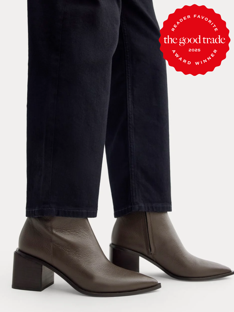 A person wearing dark pants and brown heeled ankle boots stands on a white background. A red "The Good Trade 2023 Reader Favorite Award Winner" badge is in the top right corner.