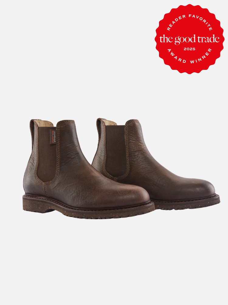 A pair of brown leather Chelsea boots on a white background. A red badge in the corner reads "Reader Favorite, The Good Trade, Award Winner 2025.