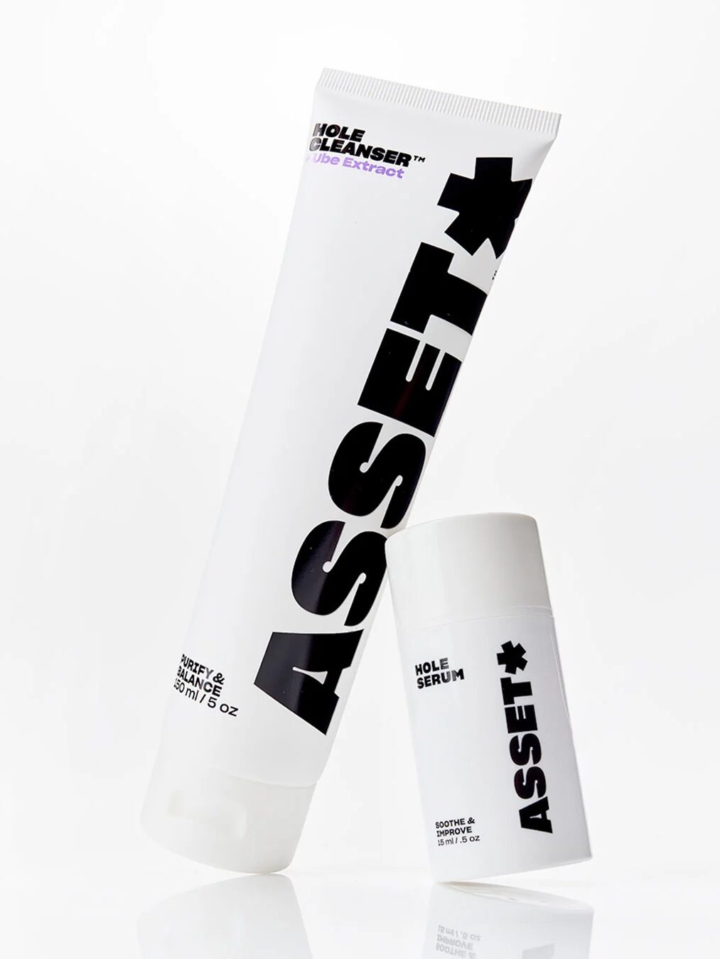 Two white skincare products labeled "ASSET" include a tube of "Hole Cleanser" and a small bottle of "Hole Serum," both with black bold text and minimalist design, on a white background.