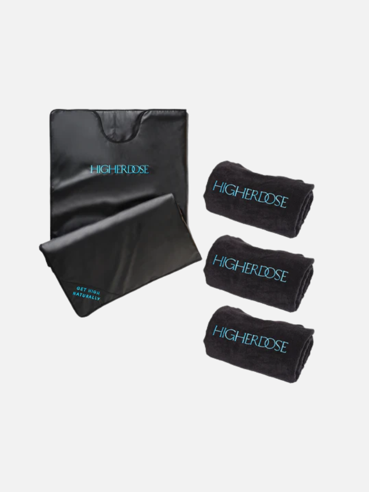 A black sauna blanket and three rolled black towels, all labeled "HigherDOSE," displayed on a plain white background.