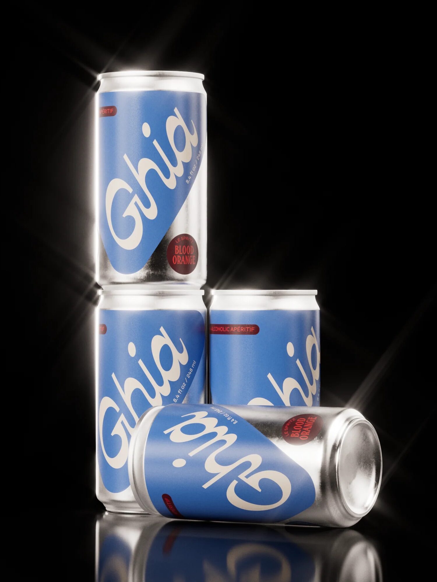 Four cans of Ghia blood orange beverage are arranged on a reflective black surface, with three cans stacked and one can lying on its side.