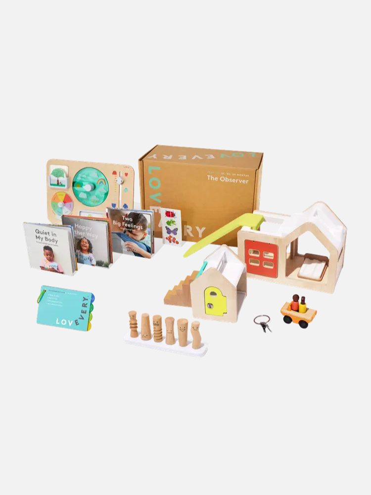 A set of educational toys and books, including a wooden house, peg people, cards, puzzles, and a box labeled "The Observer" arranged on a white background.