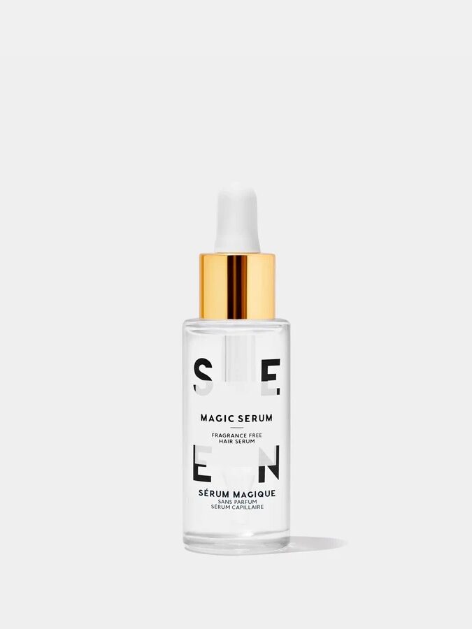 A clear glass dropper bottle labeled "S.E.L.E.N Magic Serum" with a gold cap, placed against a plain white background.