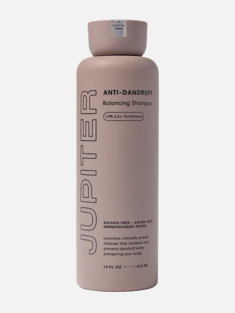 A 14 fl oz bottle of Jupiter Anti-Dandruff Balancing Shampoo with 1% zinc pyrithione in a mauve container, labeled as sulfate-free and color-safe.