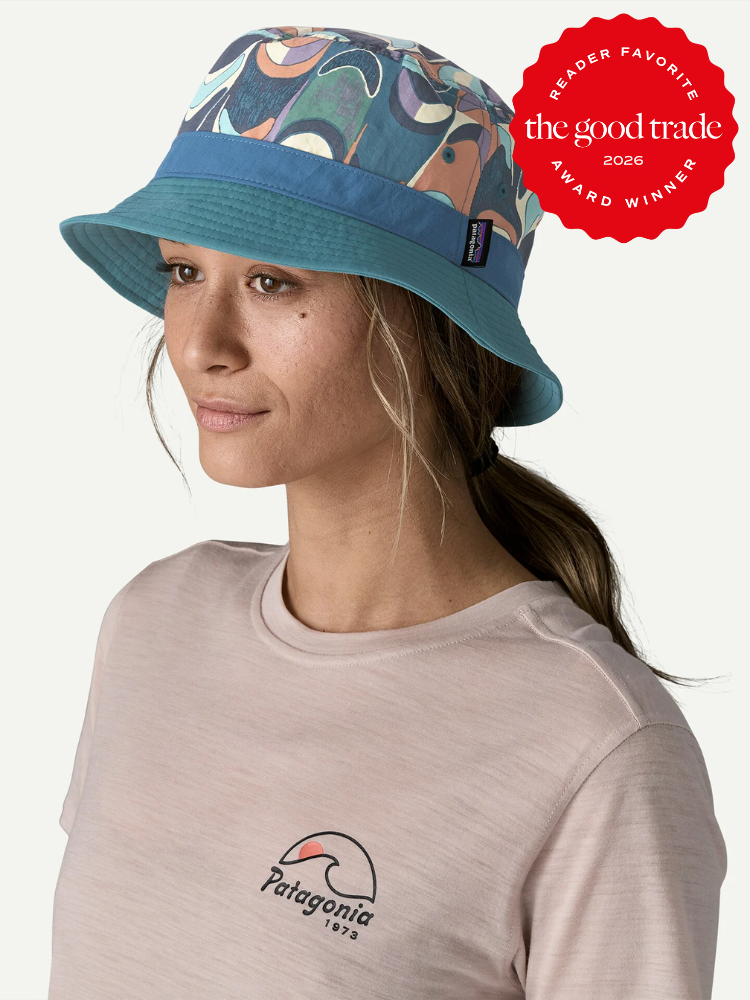 A person wearing a pastel Patagonia T-shirt and a blue patterned bucket hat looks to the side; a "The Good Trade 2026 Reader Favorite Award Winner" badge is in the top right corner.