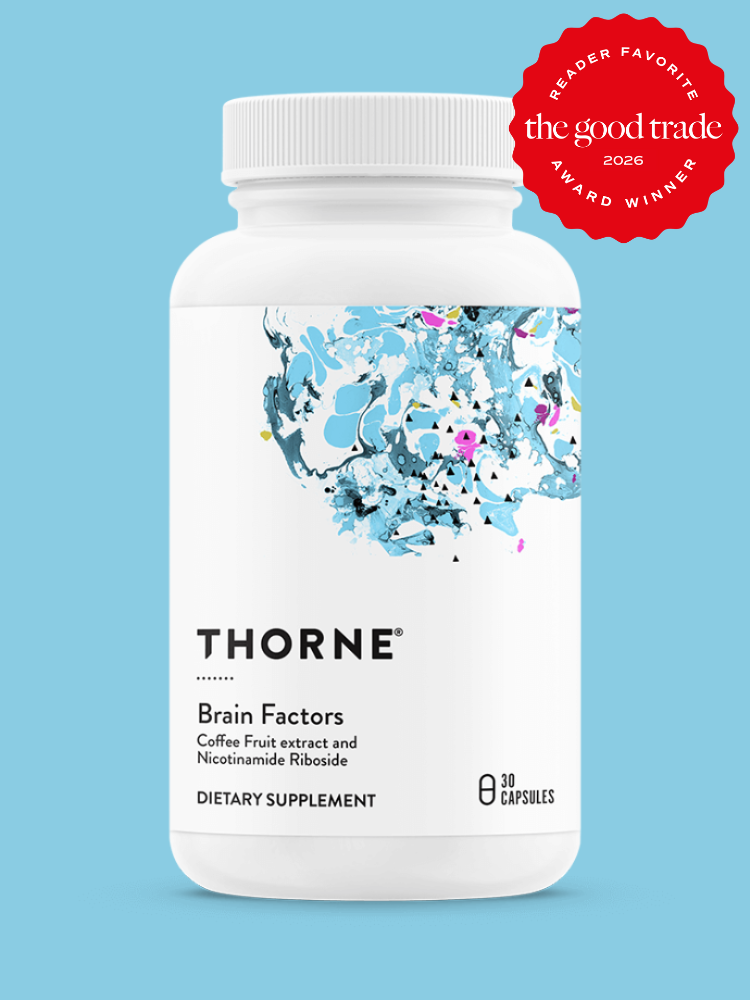 A white bottle labeled "Thorne Brain Factors" dietary supplement with abstract blue artwork and a red "The Good Trade 2026 Award Winner" badge in the top right corner.